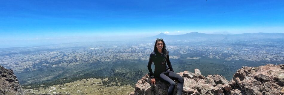 Shreya sitting on a rock on the summit of La Malinche